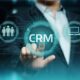 A businessman digitially representing the importance of CRM solutions